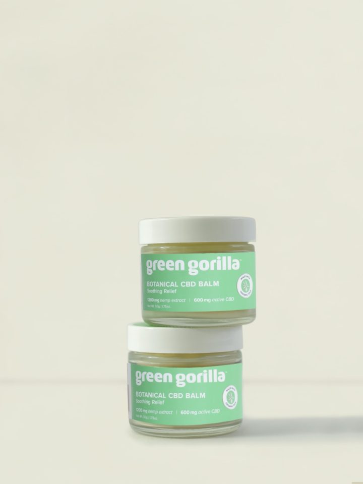 Two stacked jars of Green Gorilla™ CBD oil hemp balm