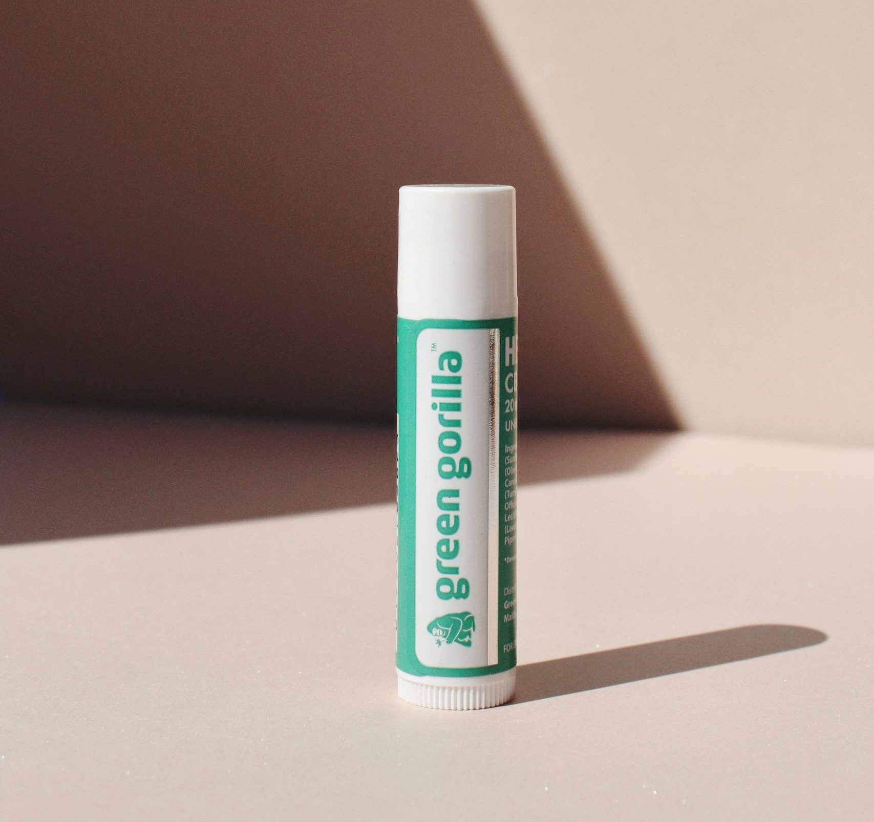 A single CBD lip balm sat upright