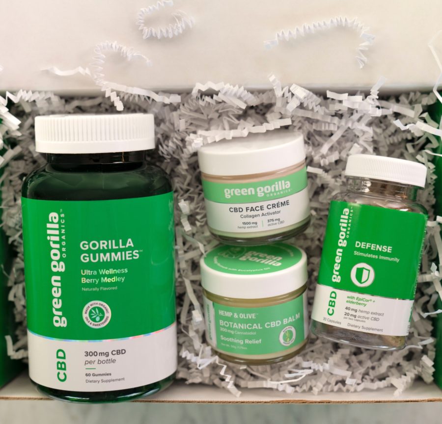 A gift bundle of CBD gummies, face cream, botanical balm, and Green Gorilla™ Defense capsules.
