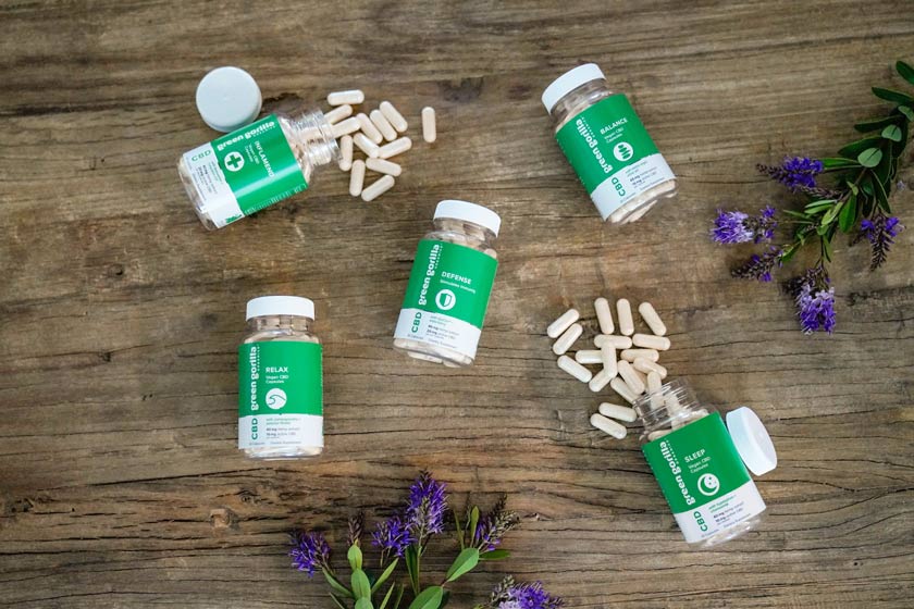 Open bottles of CBD capsules