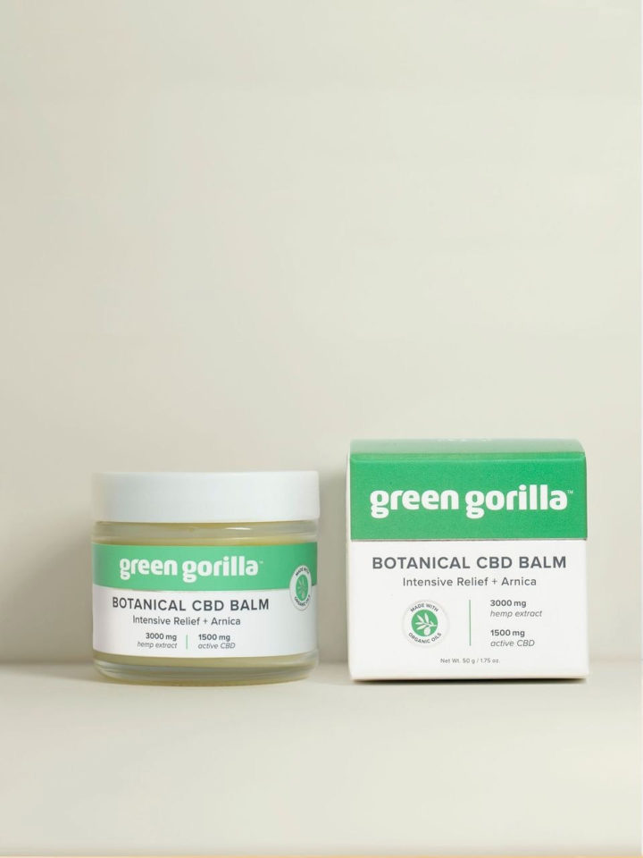 Jar and box of Green Gorilla™ botanical CBD balm on white background