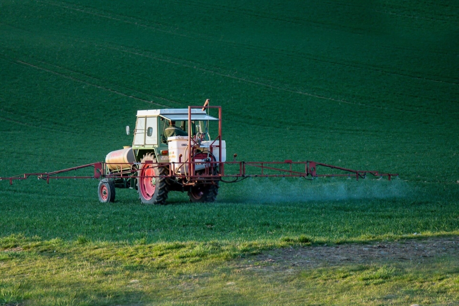 tractor spraying field