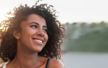 Outdoor portrait of beautiful smiling african-american woman